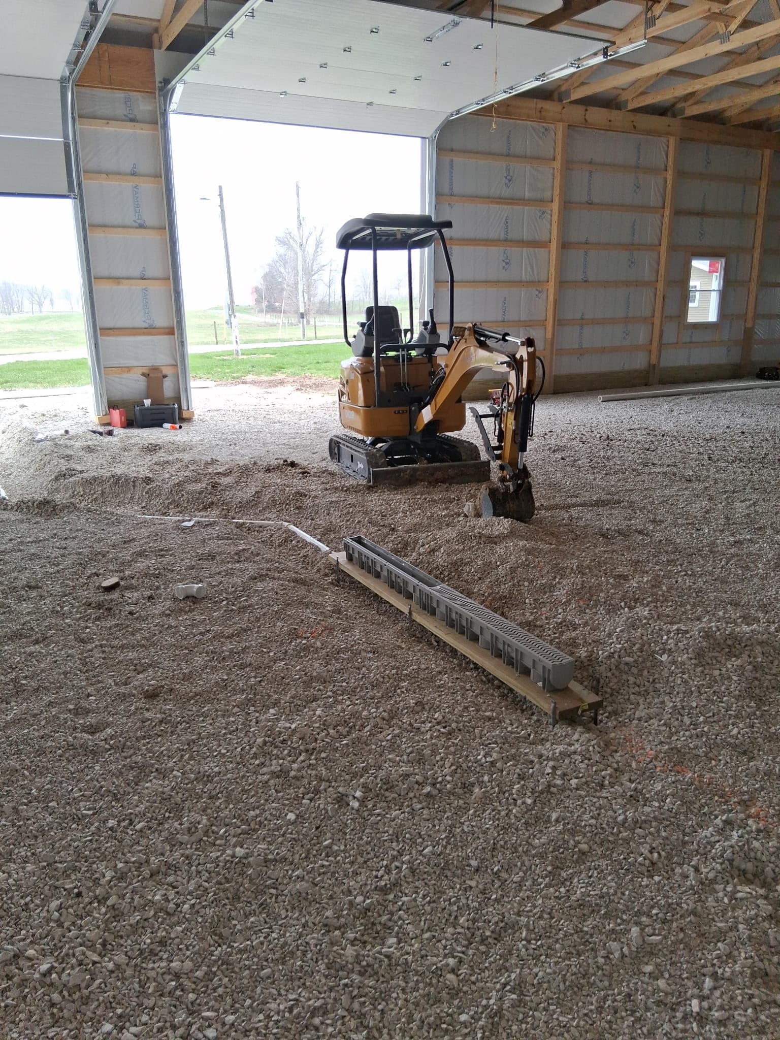 Underground drain line installation with mini excavator by Primeline Plumbing